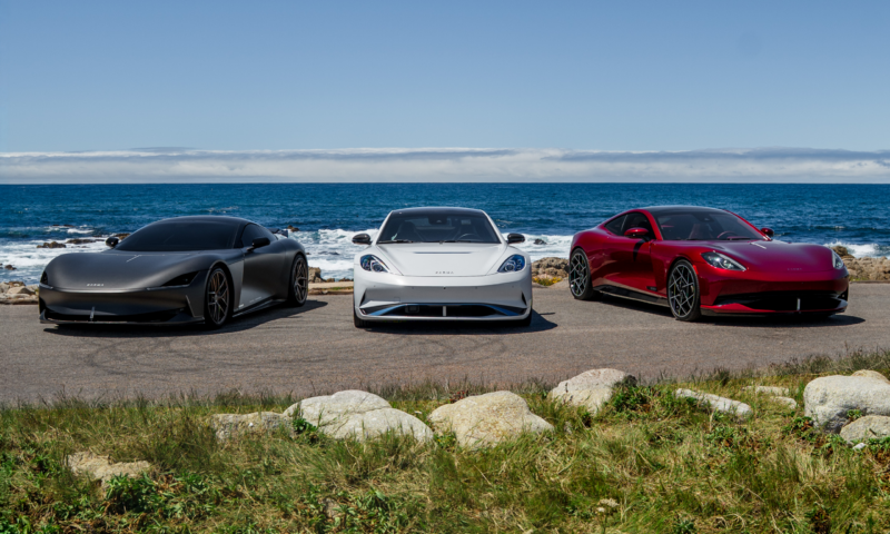 A satin black Karma Kaveya, white Karma Gyesera, and red Karma Amaris on 17-Mile Drive.