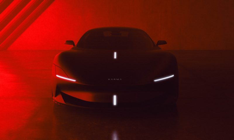 A satin blue Karma Kaveya in a sci-fi interior space under red lighting.
